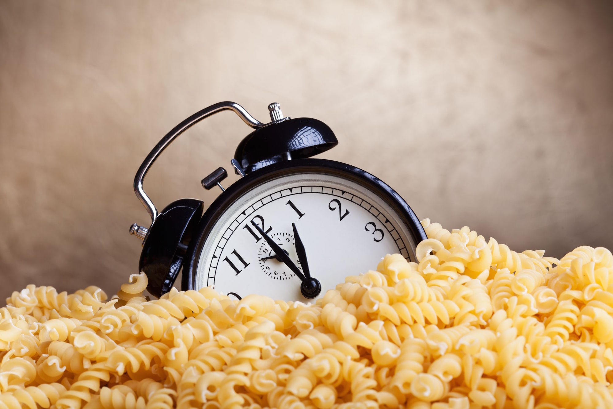 14258128 - time for pasta - alarm clock covered with pasta