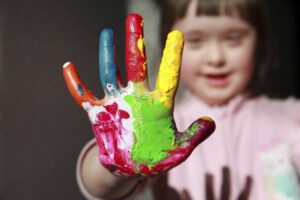 Cute girl with painted hand