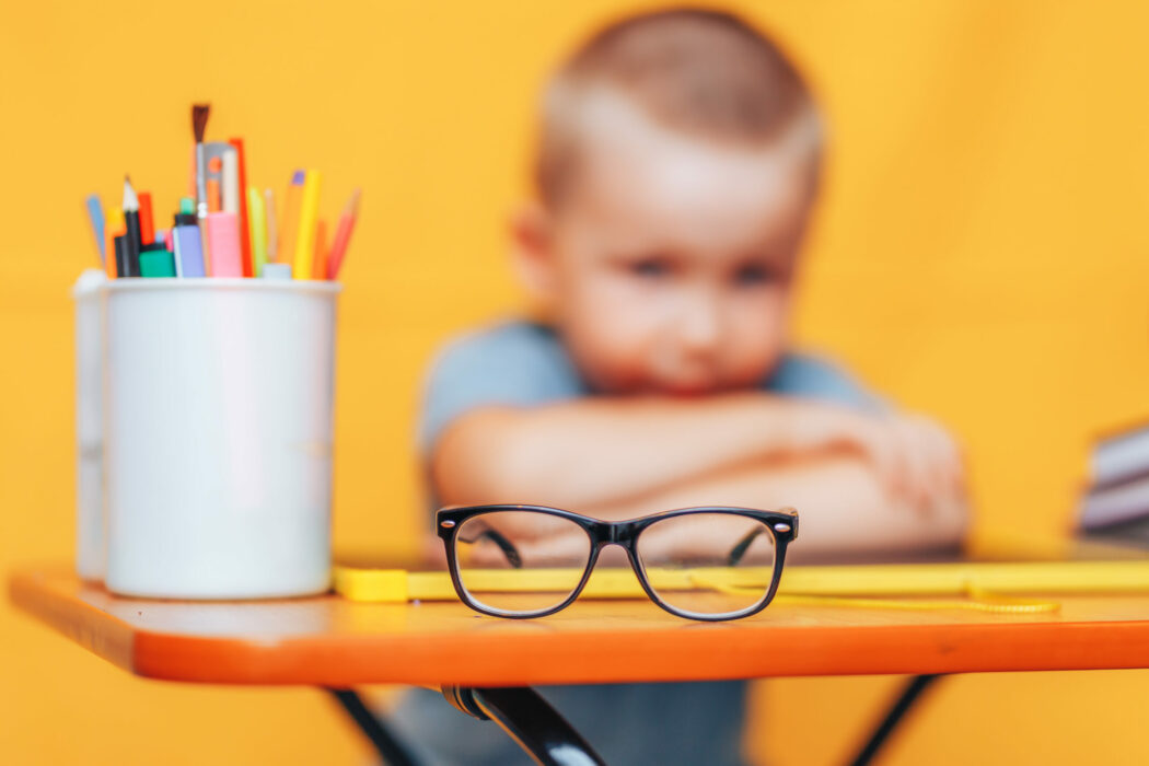 Boy,Sitting,Ubfocused,Glasses,In,Focus.,Concept,Problem,Of,Ophthalmology